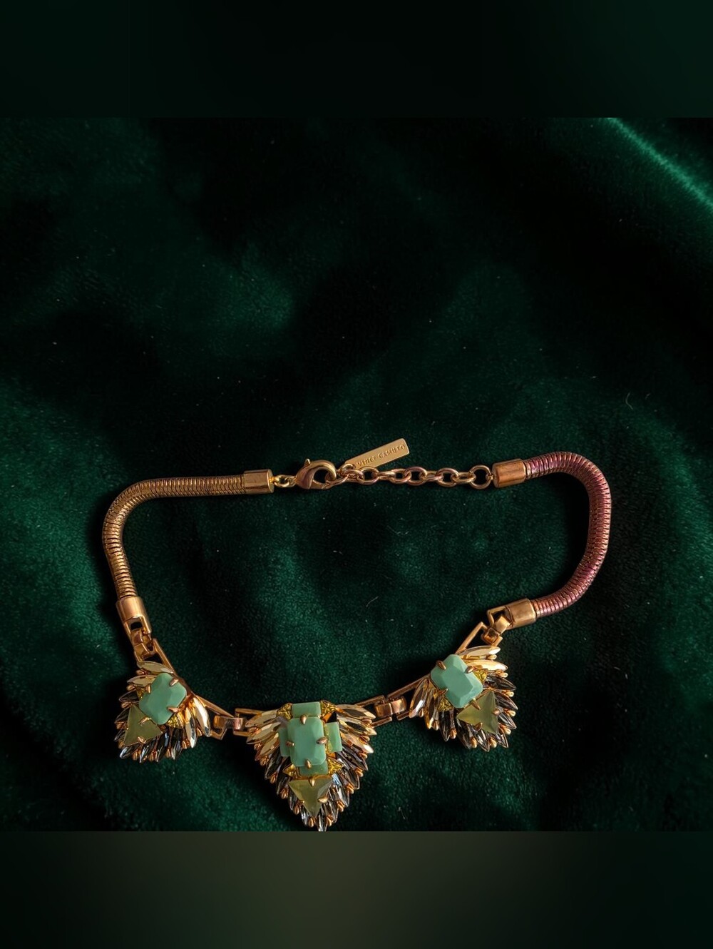 Vince Camuto gold-tone statement necklace features large green stone pendants